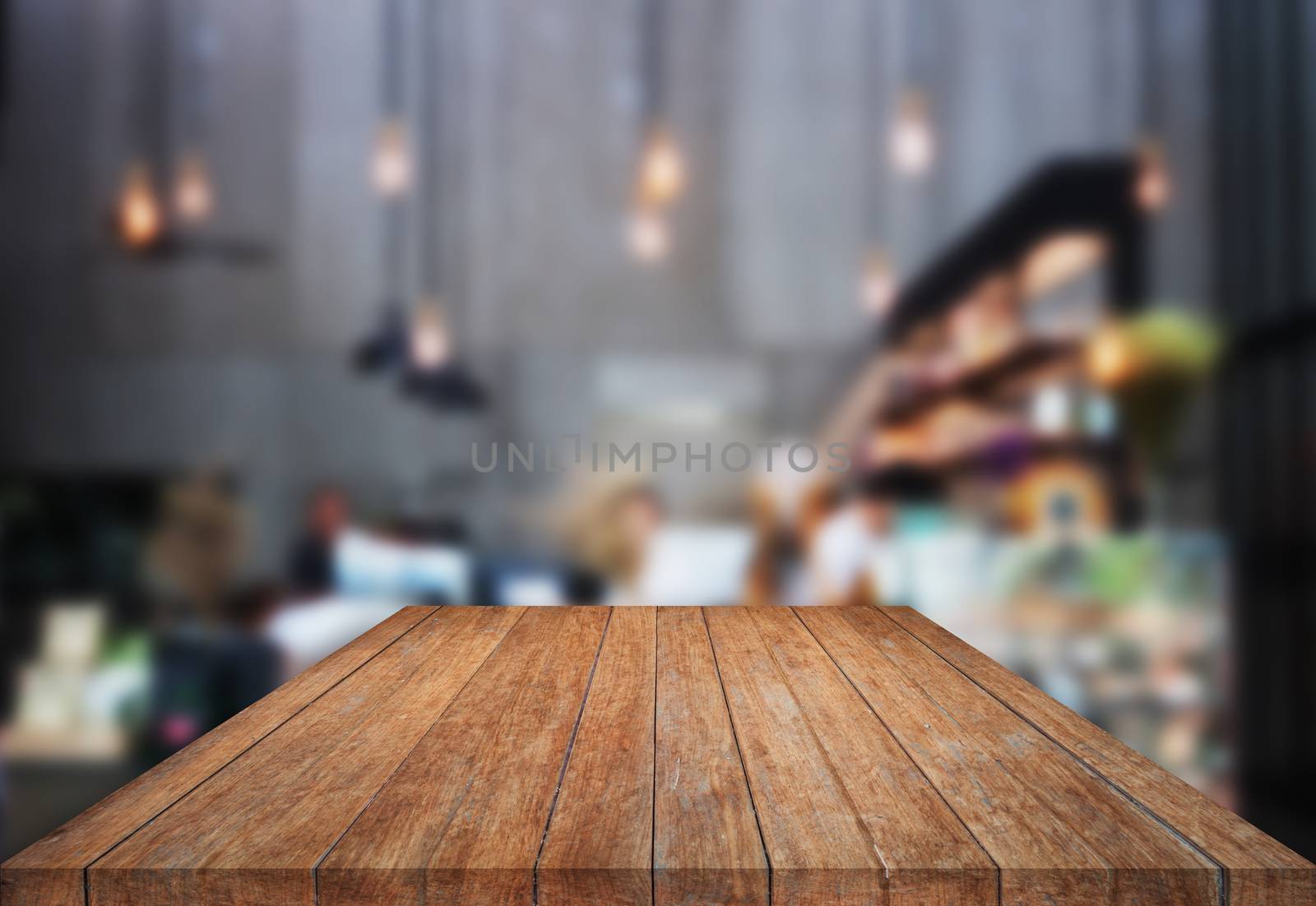 Table top wooden with blurred background in coffee shop by punsayaporn