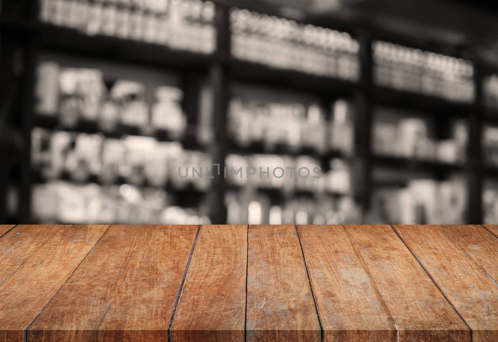 Wooden tabletop with sepia blurred background, stock photo