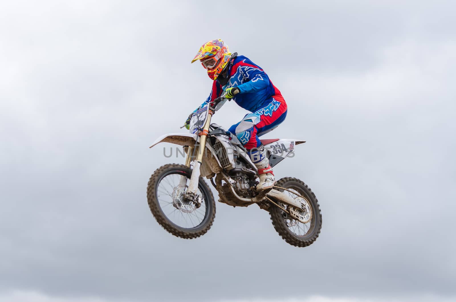 Volgograd, Russia - April 19, 2015: Motorcycle racer flying jumping on the trampoline, on the stage of the open championship motorcycling Cup cross-country Volgograd Region Governor