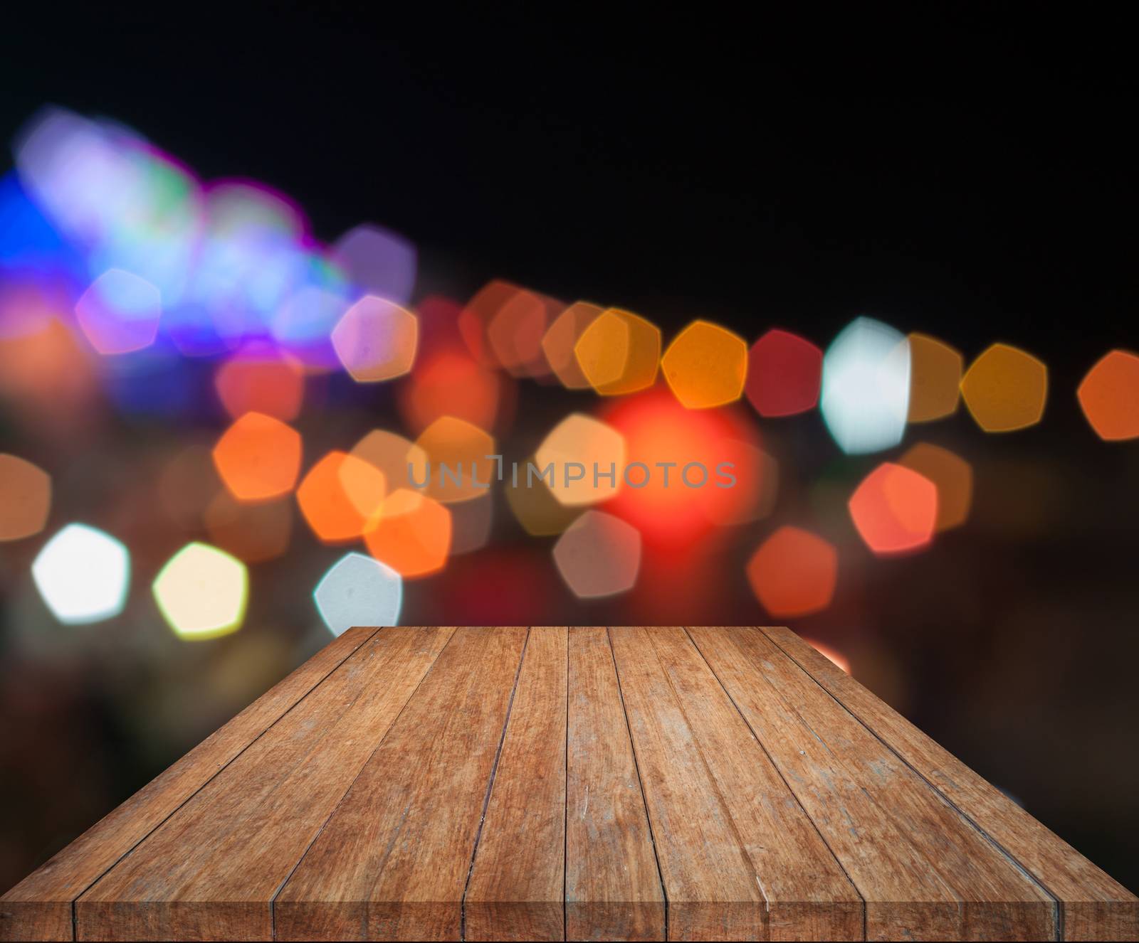 Top wooden with abstract blurred bokeh lights by punsayaporn