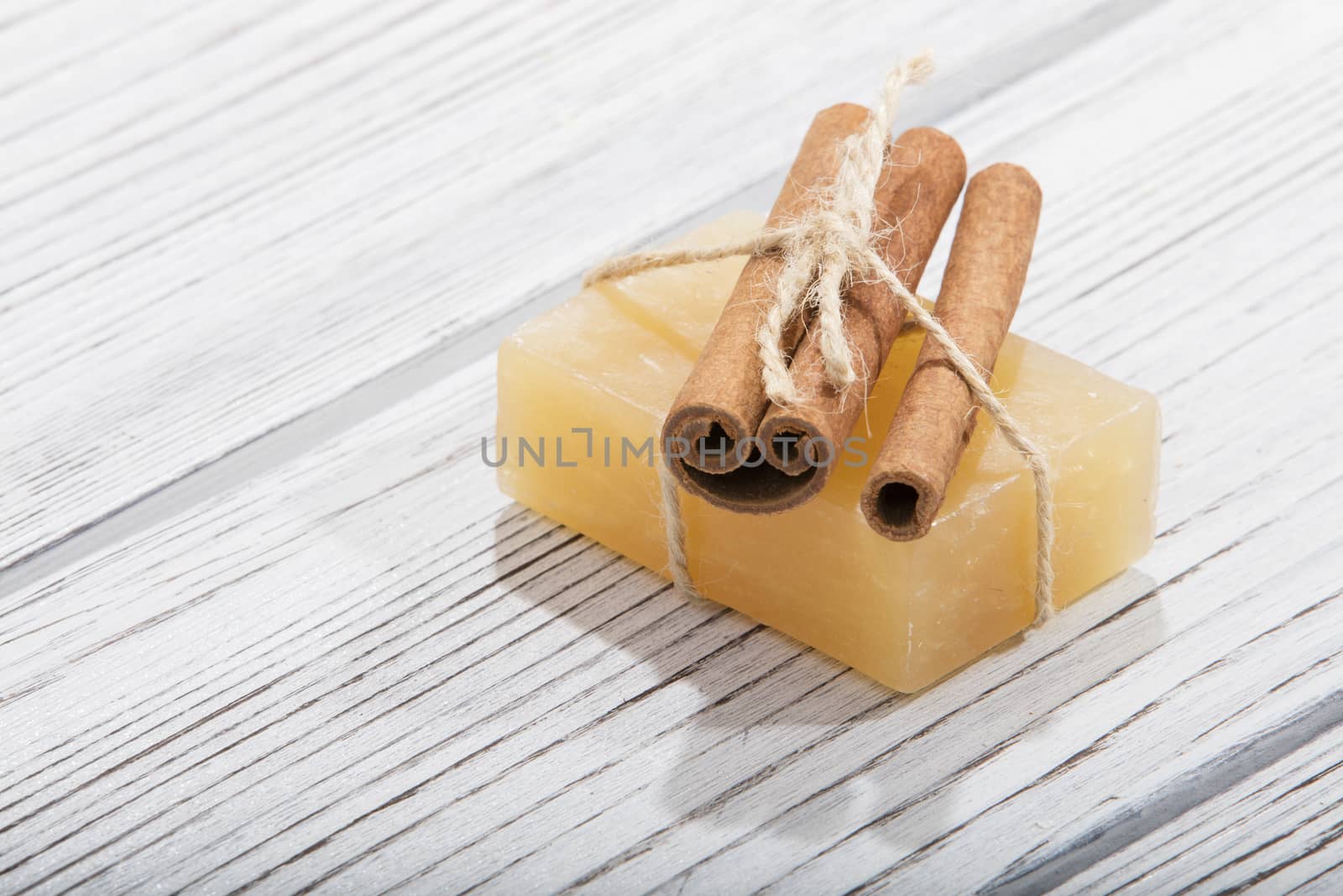 handmade soap with cinnamon on wooden background by senkaya