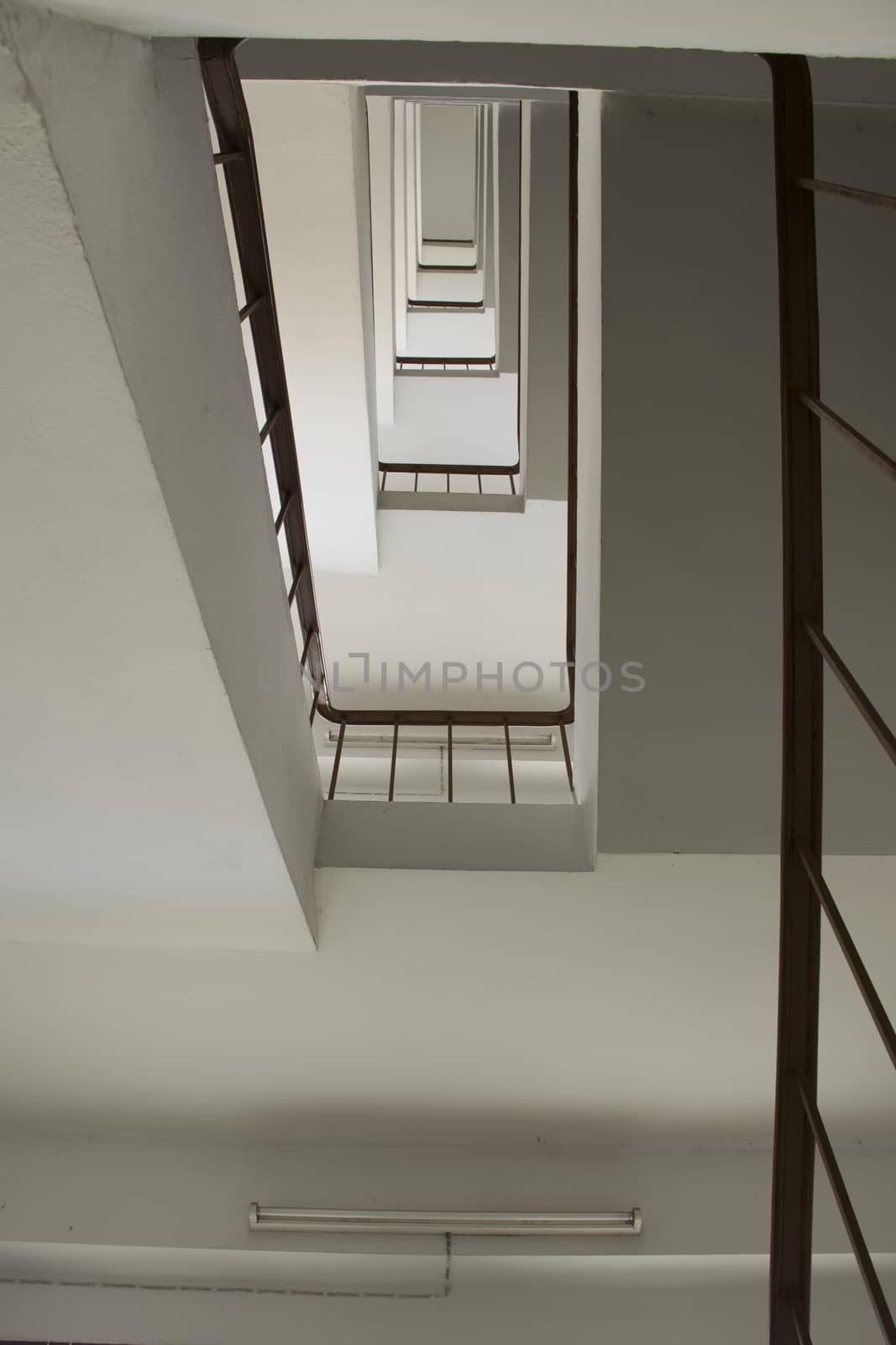 looking up stairwell building. Abstract architecture background.