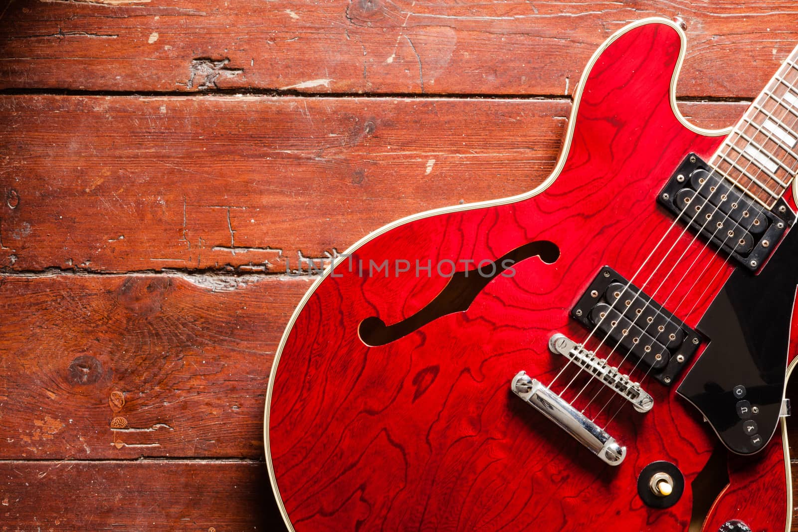 Acoustic guitar on wood background by andongob