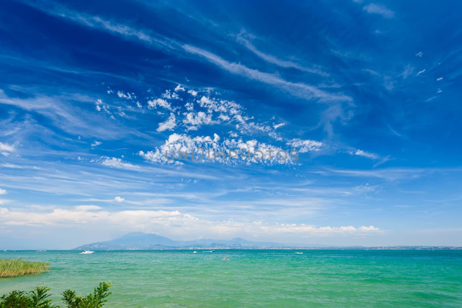 High mountains on other coast of Garda lake, Desenzano, italy