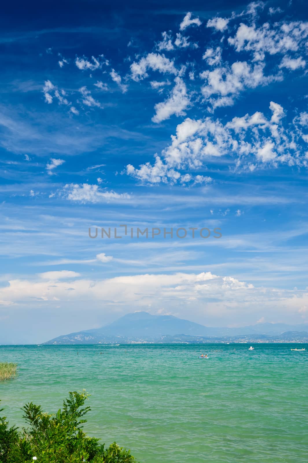 High mountains on other coast of Garda lake, Desenzano, italy