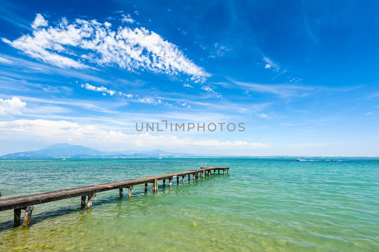 High mountains on other coast of Garda lake, Desenzano, italy