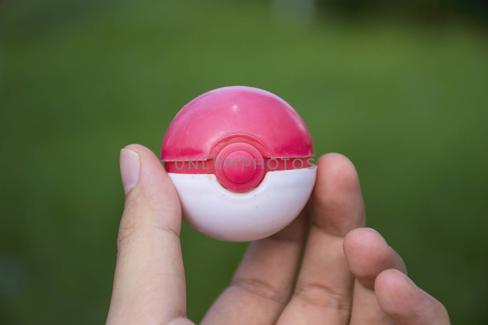 Poke ball toy in Hand  (Pokemon Ball). by sky_sirasitwattana