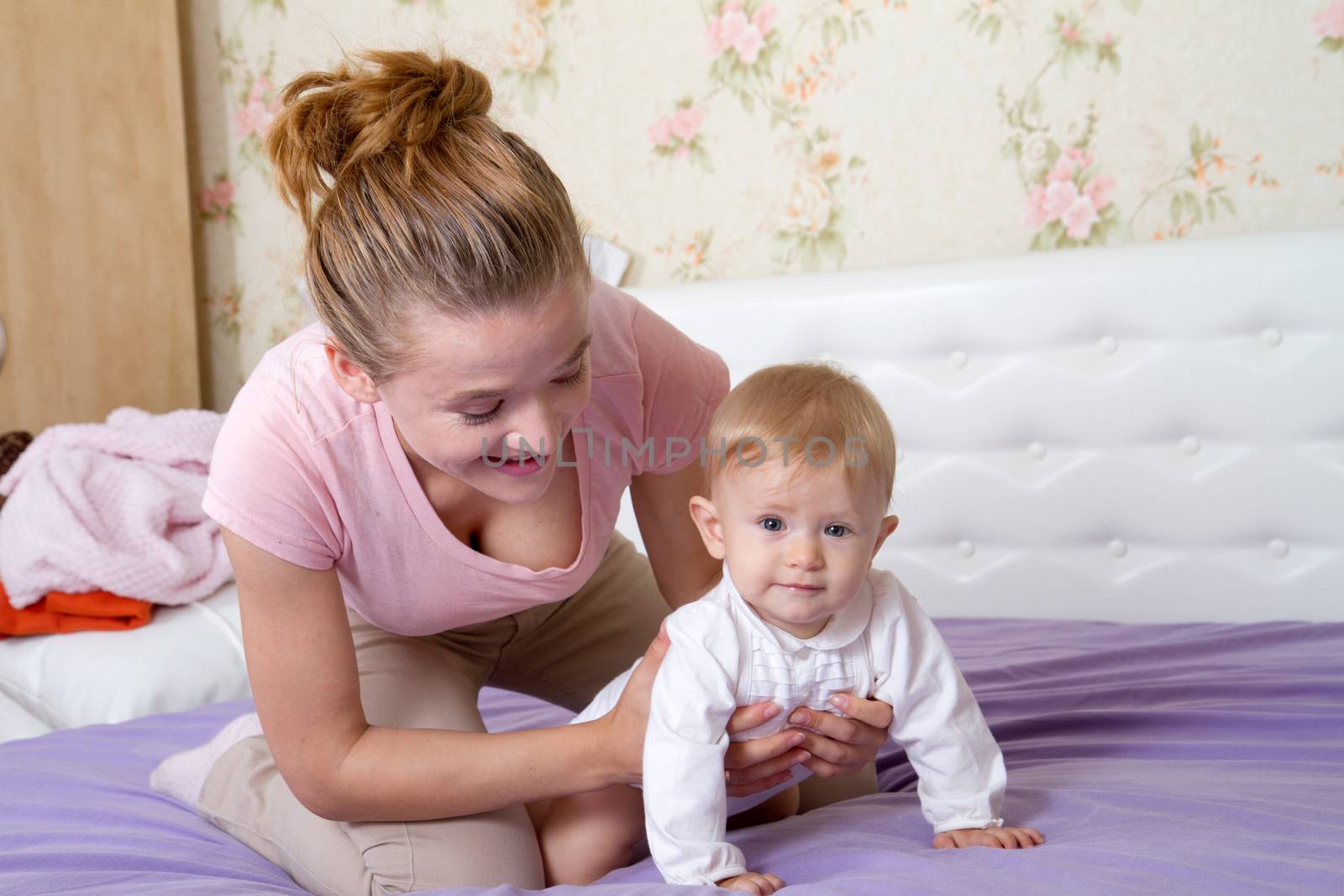 Mom playing with a little girl, baby by Irina1977