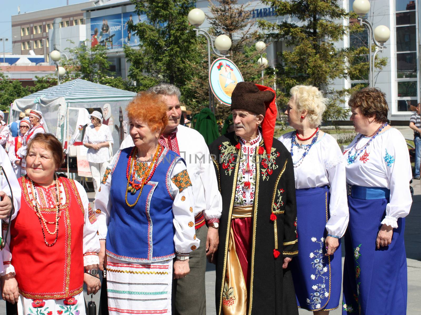 Tyumen, Russia - May 26 2012. Festival of national cultures Friendship Bridge. Peoples in Kazakh national dress ready for a concert. In the backyard are the presentation of the national dishes, show rituals are examples of arts and crafts, conduct master classes of traditional national crafts and trades and local cuisine.