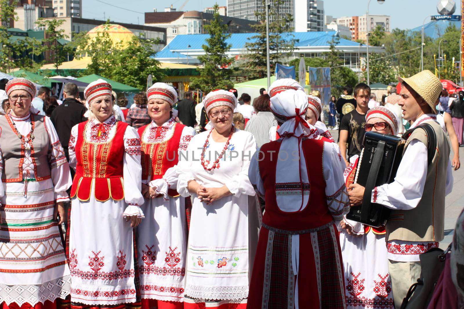 Tyumen, Russia - May 26 2012. Festival of national cultures Friendship Bridge. Peoples in Kazakh national dress ready for a concert. In the backyard are the presentation of the national dishes, show rituals are examples of arts and crafts, conduct master classes of traditional national crafts and trades and local cuisine.