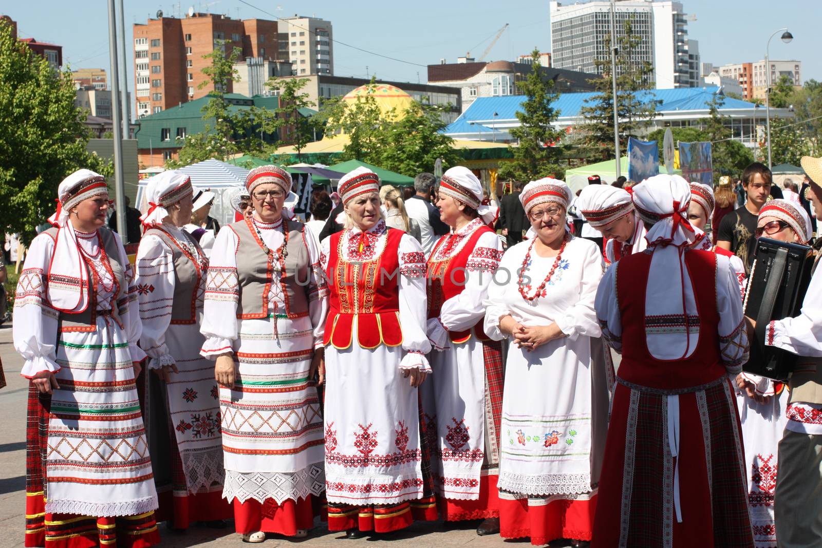 Tyumen, Russia - May 26 2012. Festival of national cultures Friendship Bridge. Peoples in Kazakh national dress ready for a concert. In the backyard are the presentation of the national dishes, show rituals are examples of arts and crafts, conduct master classes of traditional national crafts and trades and local cuisine.