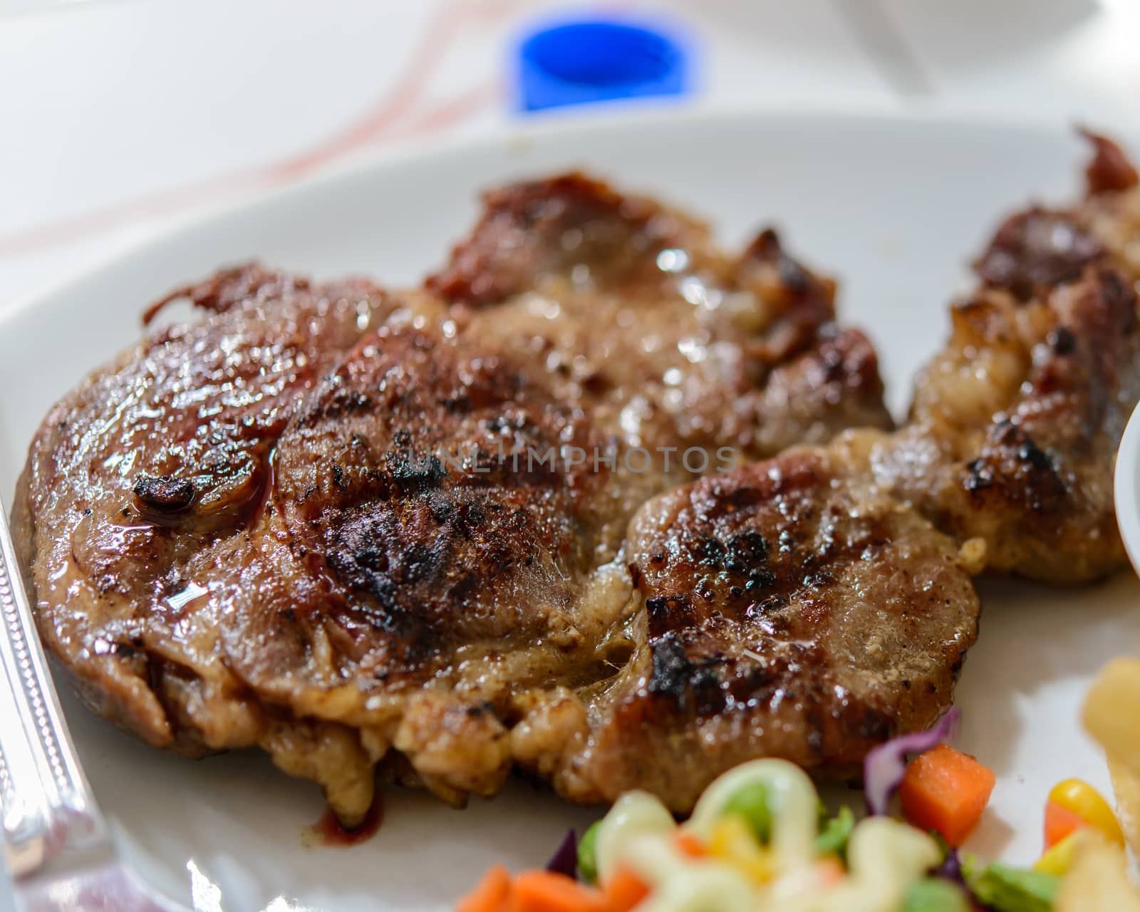 Beef steak on plate.Soft focus.