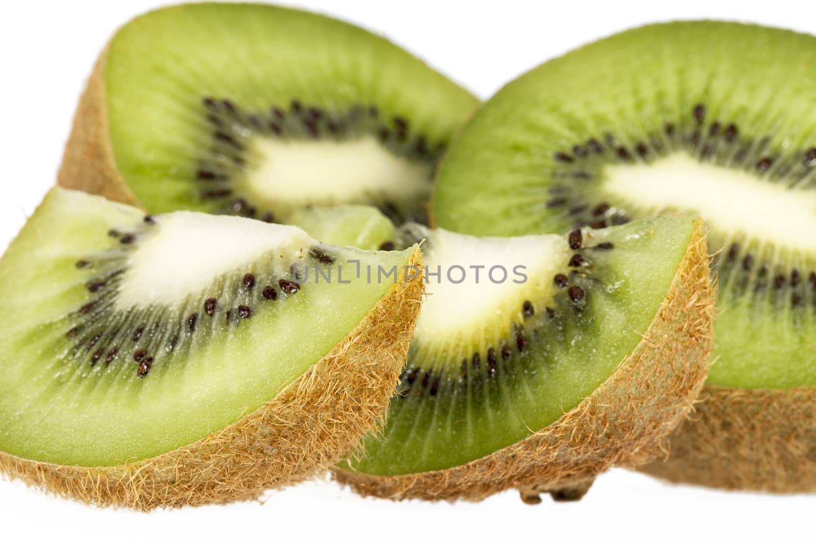 Pieces of green kiwi isolated on white background, close up by mychadre77