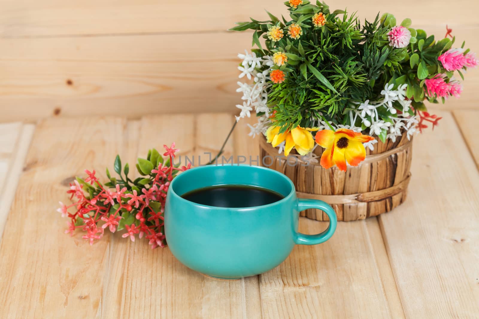 cup and vase on wood table