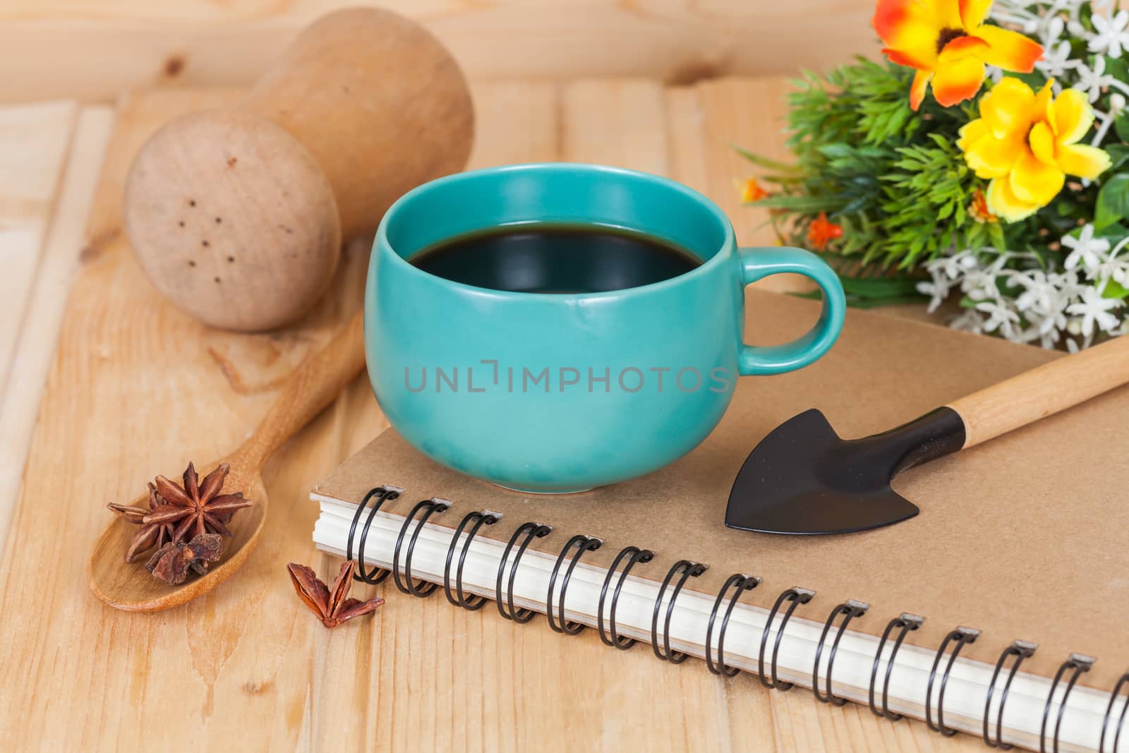 cup of coffee and book on  wood table