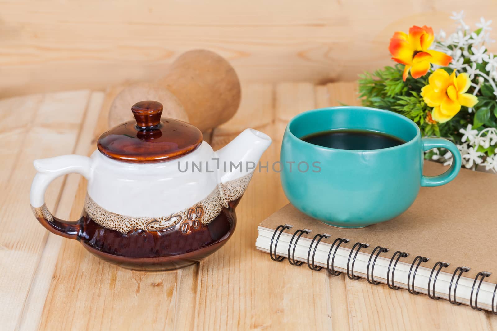 cup of coffee and book on  wood table