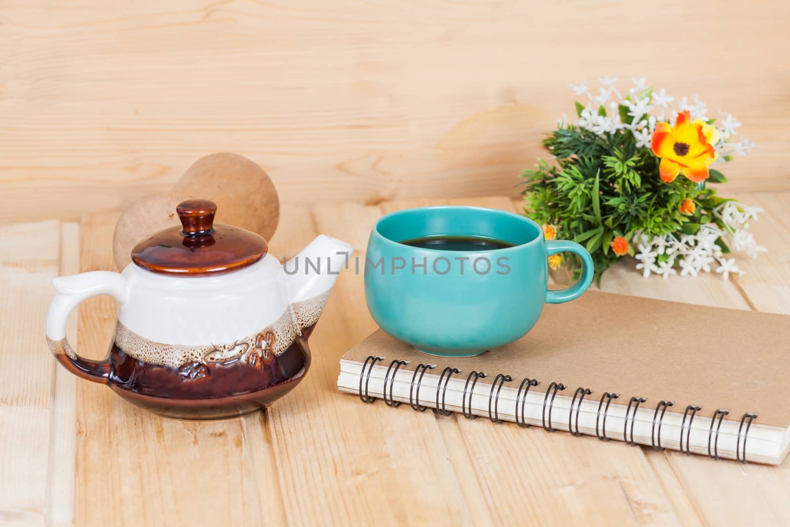 cup of coffee and book on  wood table