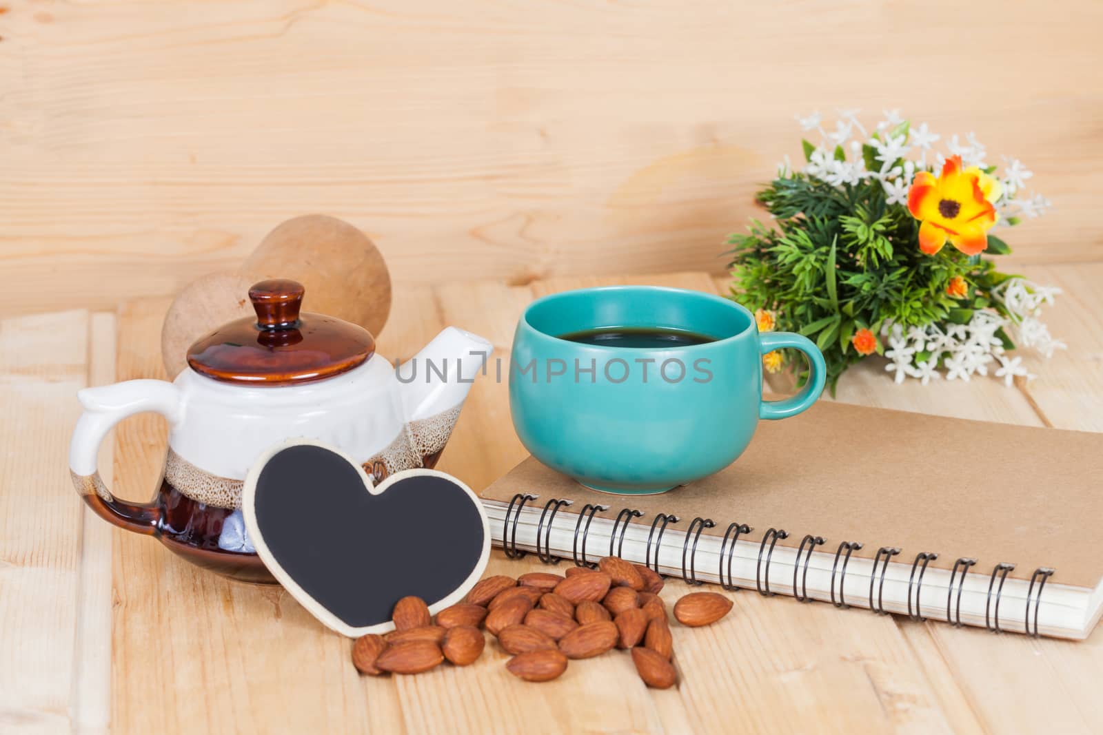 cup of coffee and book on  wood table