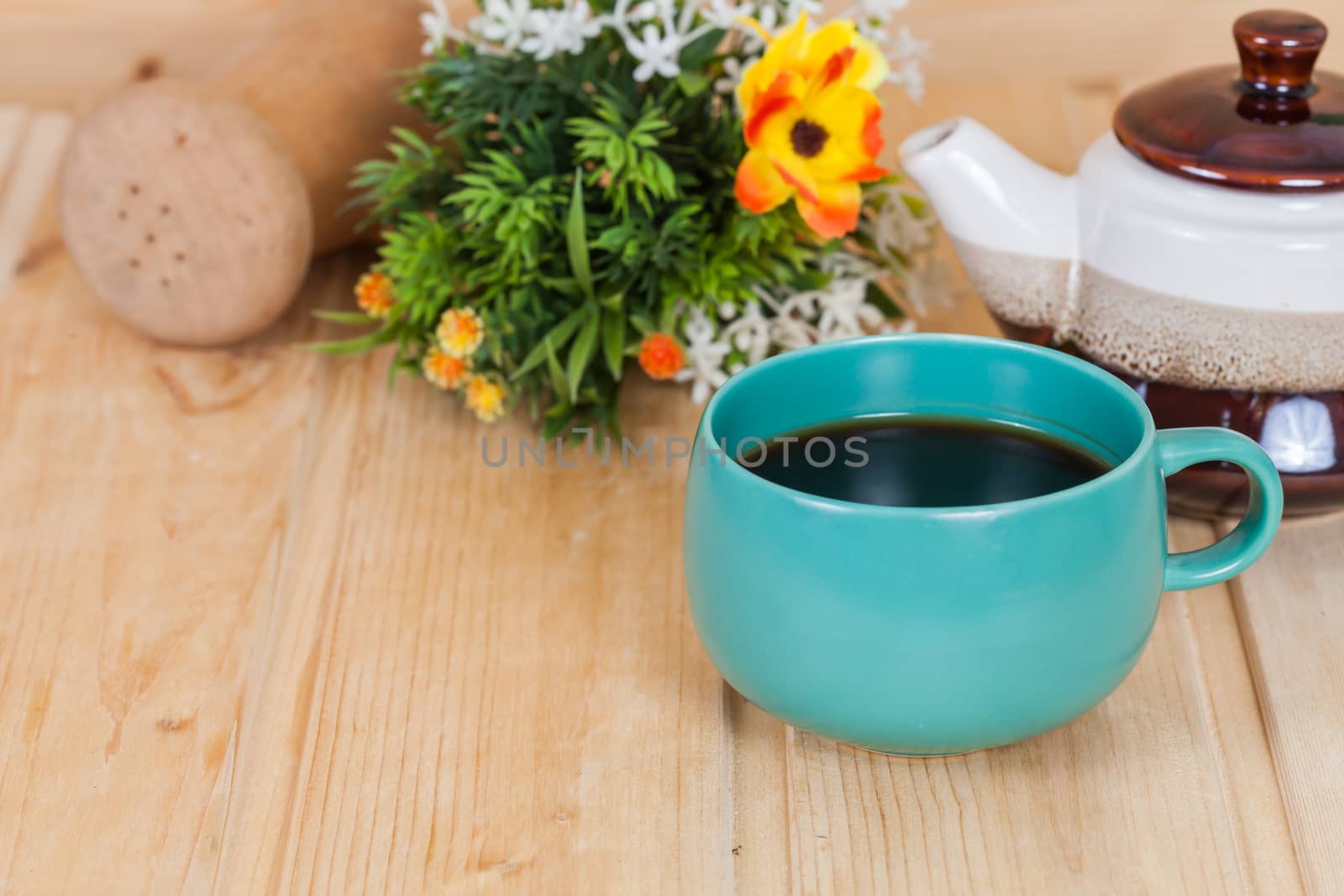 cup of coffee and book on  wood table