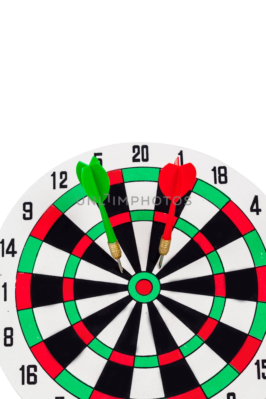 Dart arrow hitting in bullseye on dartboard