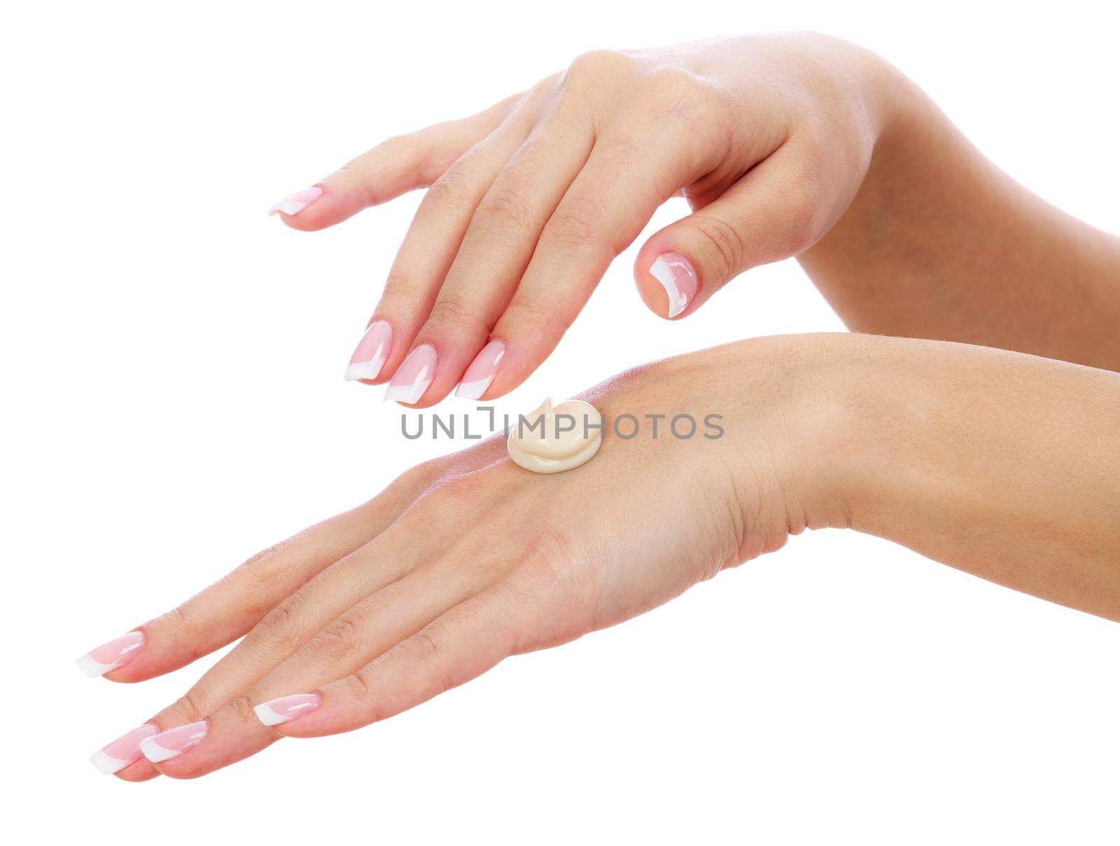 Woman hands with perfect manicure applying moisturizer cream isolated on a white background