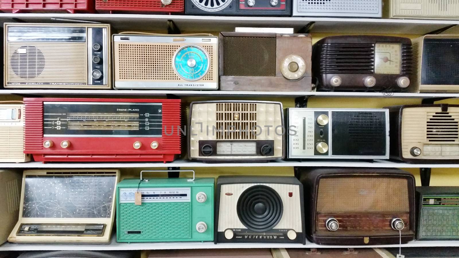 Collection of antique transistor radio arrange on the shelve