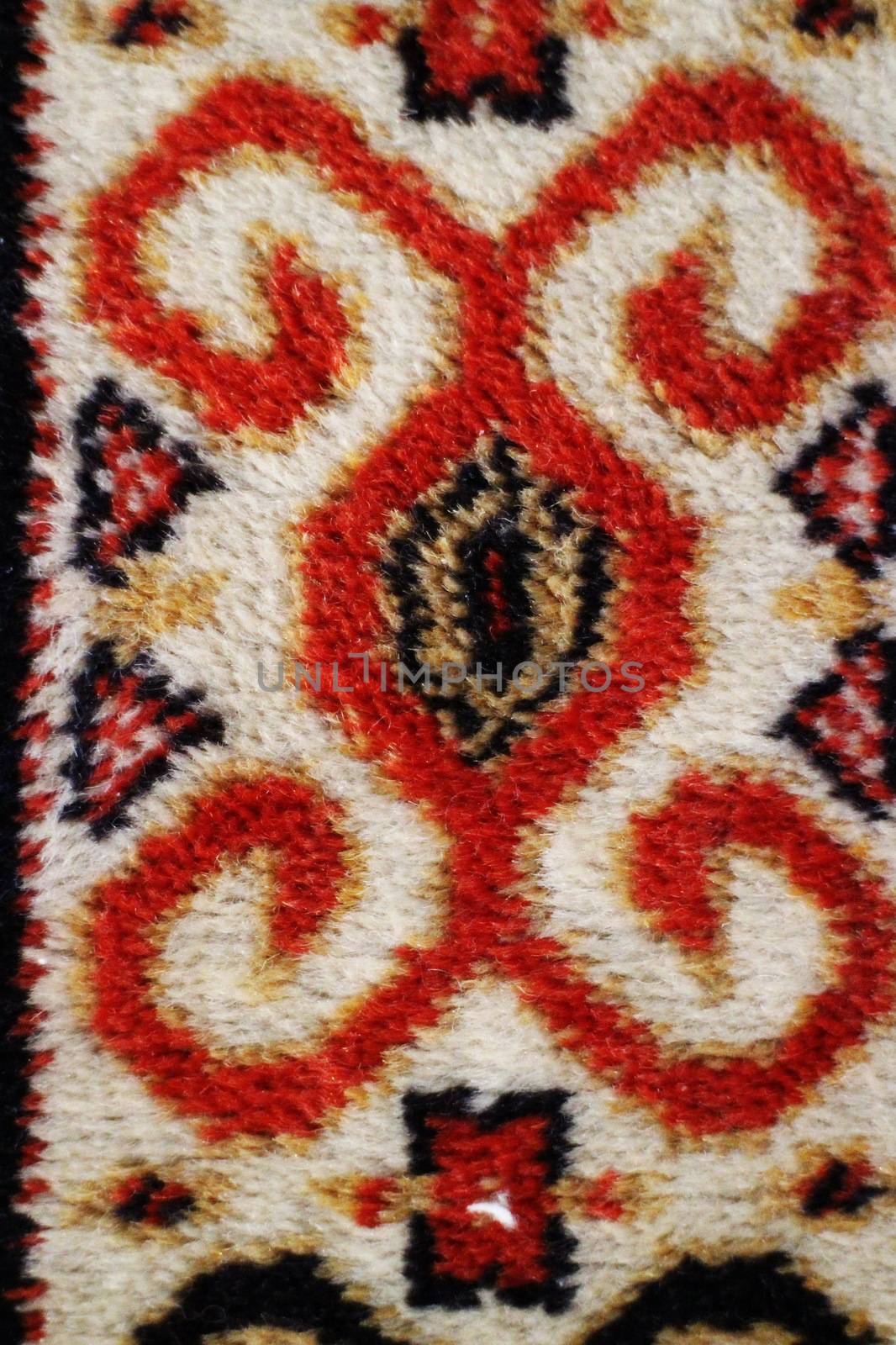 geometric  pattern old Persian carpet closeup