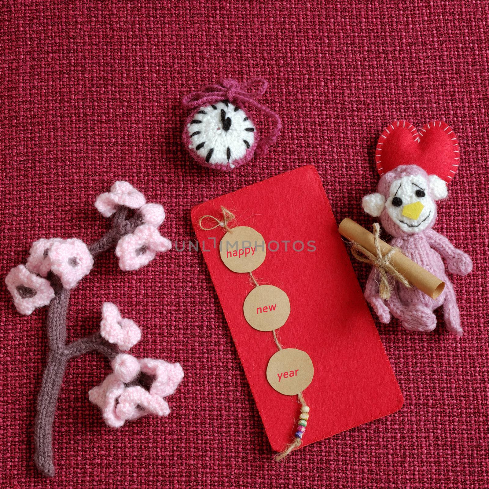 2016, year of monkey, handmade happy new year on red background, knitted monkey, funny stuffed animal, knit flower from yarn, red envelope for lucky money, sign for Vietnam Tet