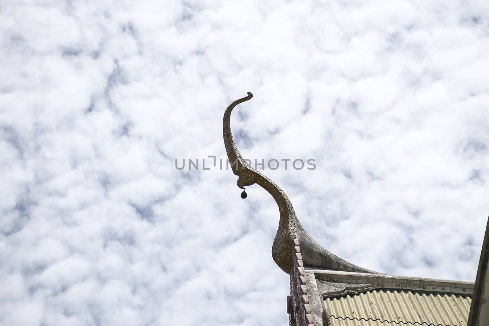 Serpent sculpture of temple roof in Thailand. ornament and detail in Thai art.