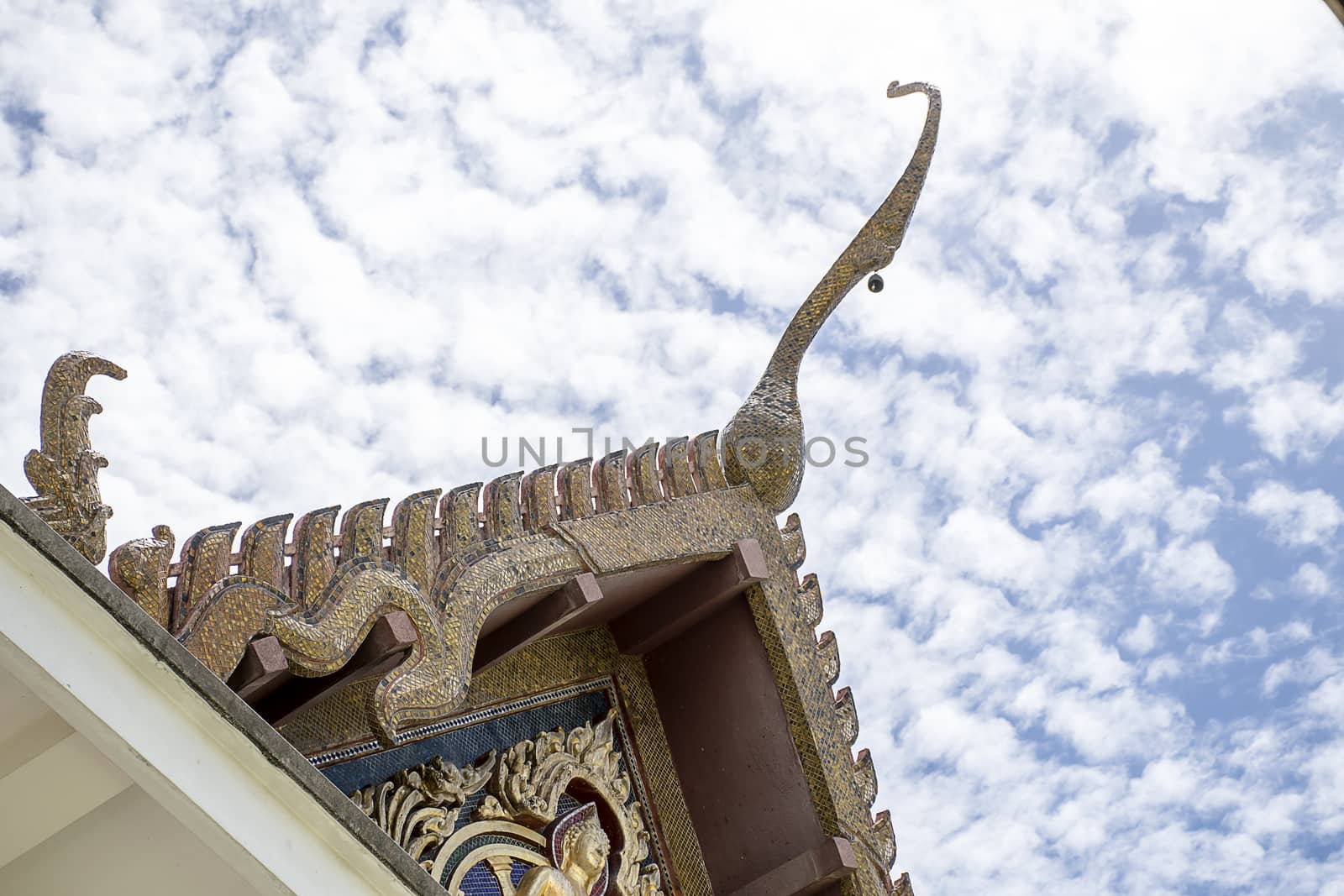 Serpent sculpture of temple roof in Thailand. ornament and detail in Thai art.