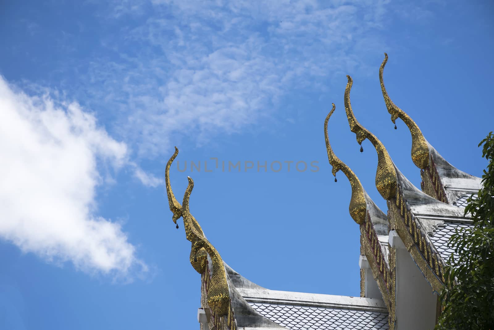 Serpent sculpture of temple roof in Thailand. ornament and detail in Thai art.