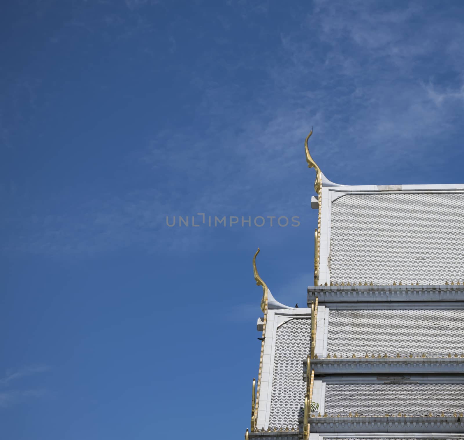 Serpent sculpture of temple roof in Thailand. ornament and detail in Thai art.