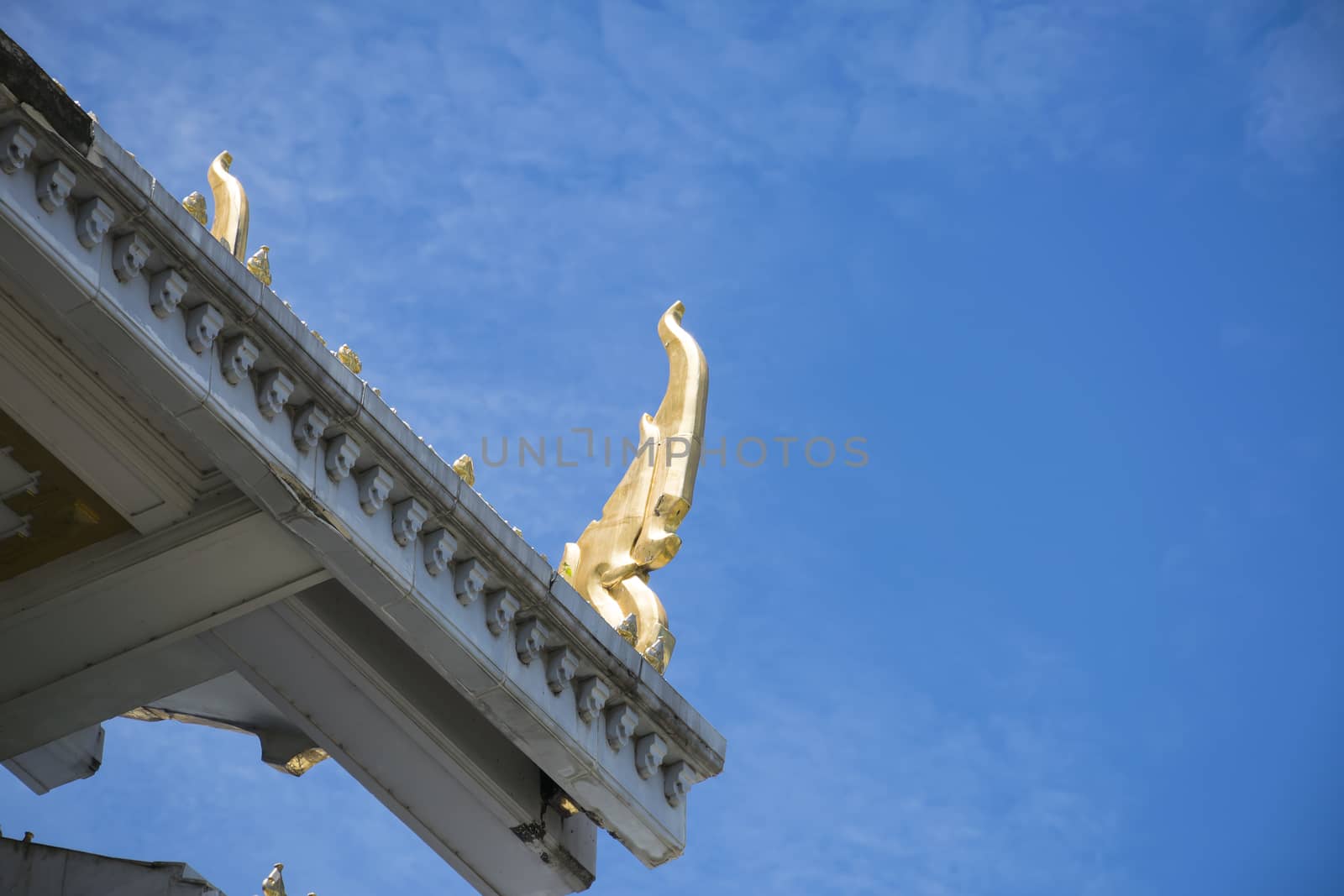 Serpent sculpture of temple roof in Thailand. ornament and detail in Thai art.