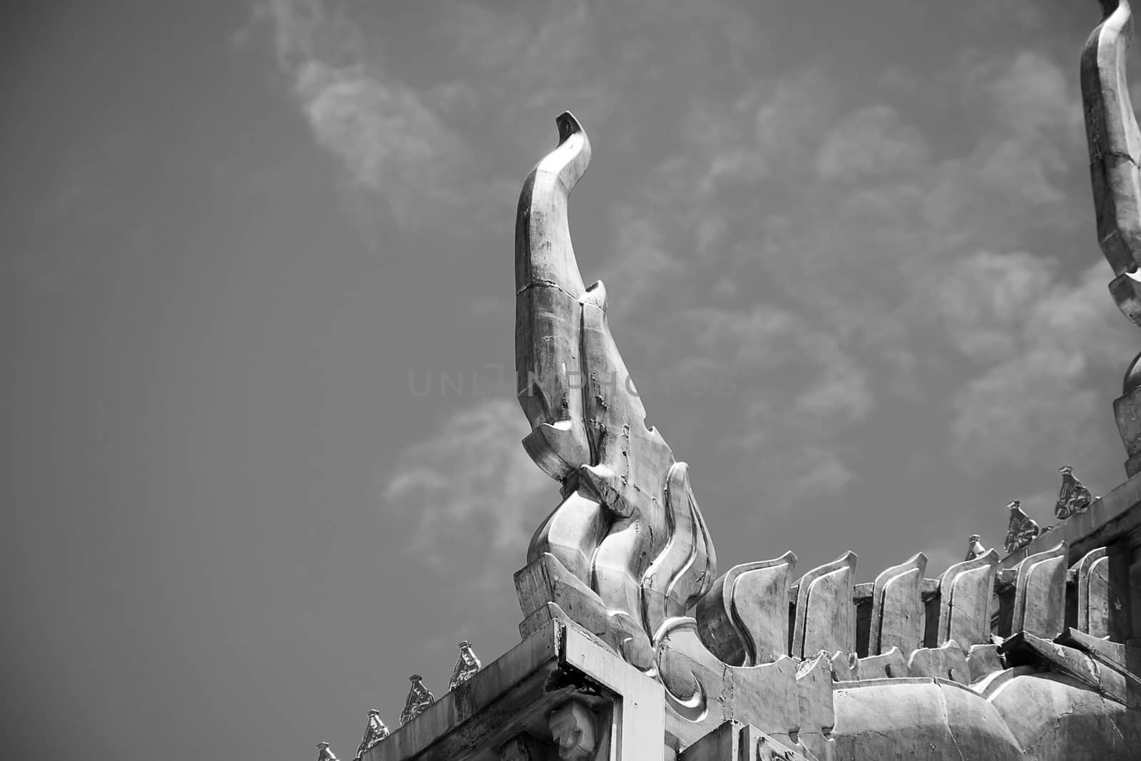 Serpent sculpture of temple roof in Thailand. ornament and detail in Thai art.