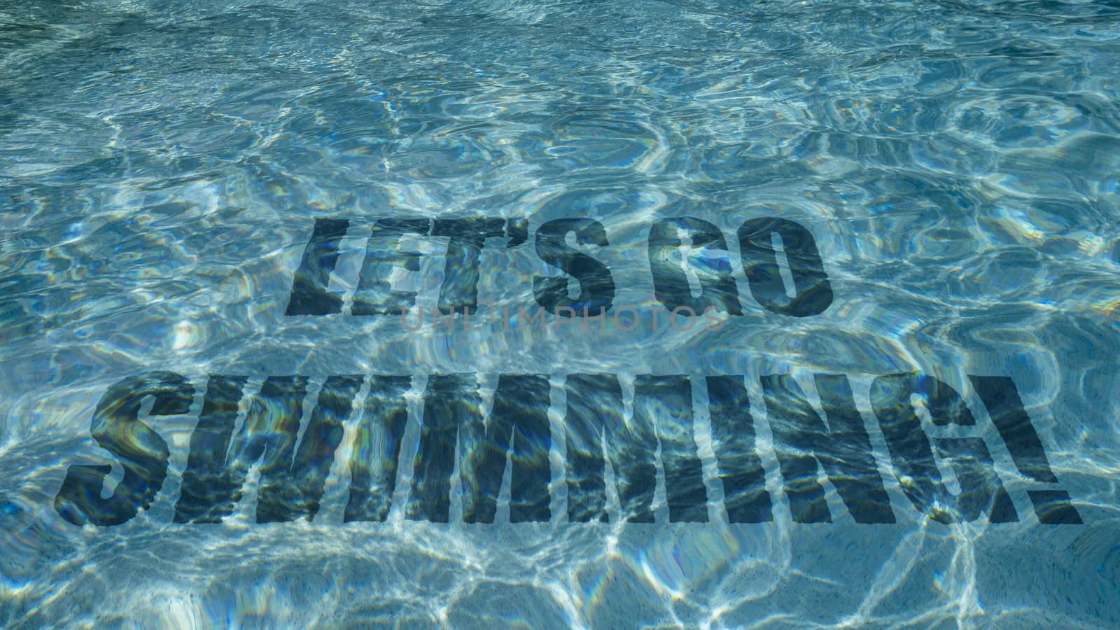 Let's go swimming text appearing under water in a swimming pool
