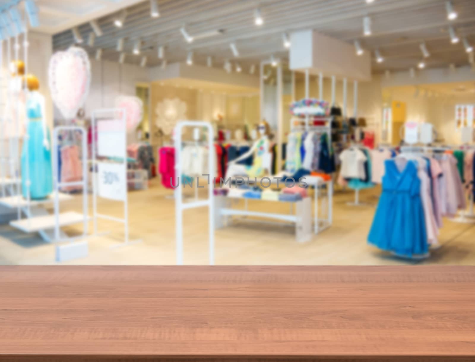 clothes in fashion store, blurred interior of cloth store