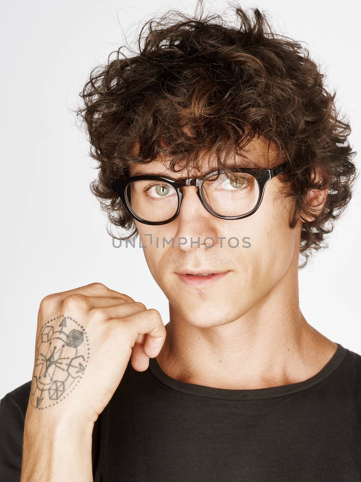 Emotional portrait of a pretty young man on white background