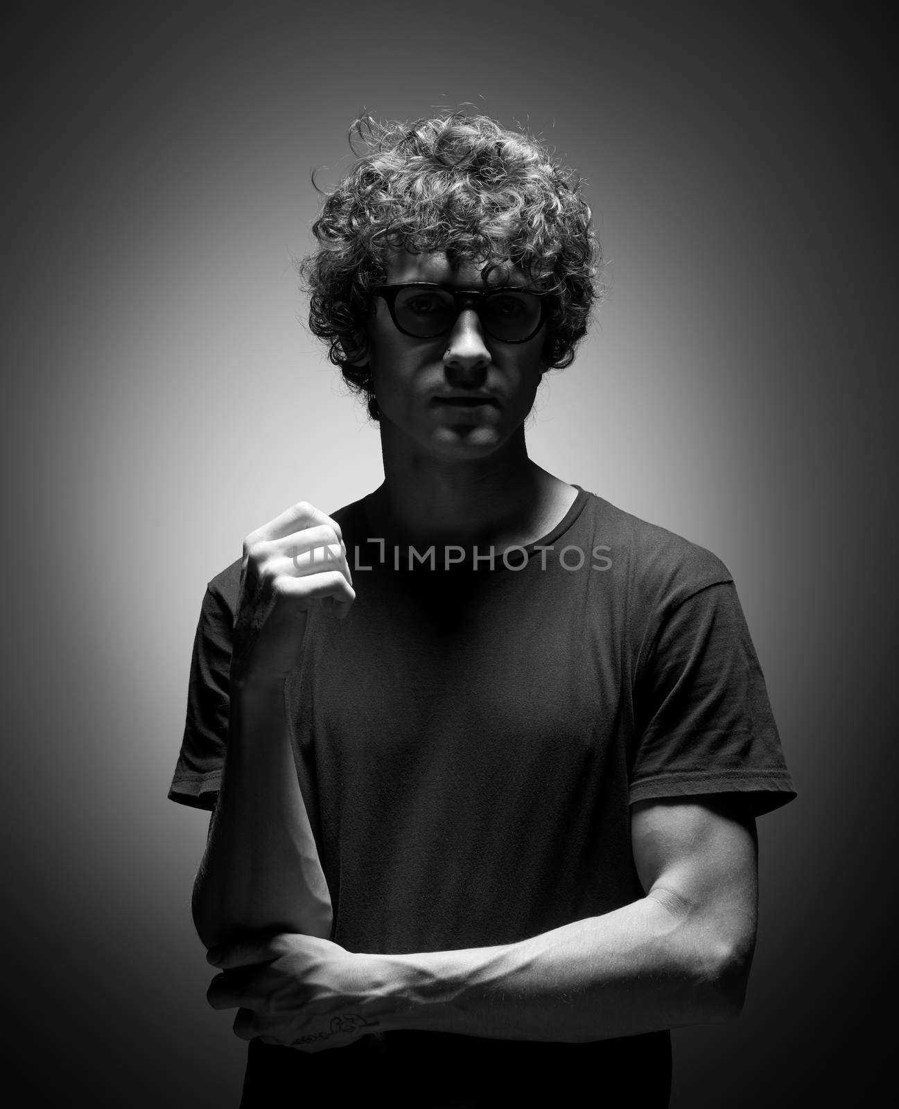 Emotional black and white dramatic portrait of a pretty young man