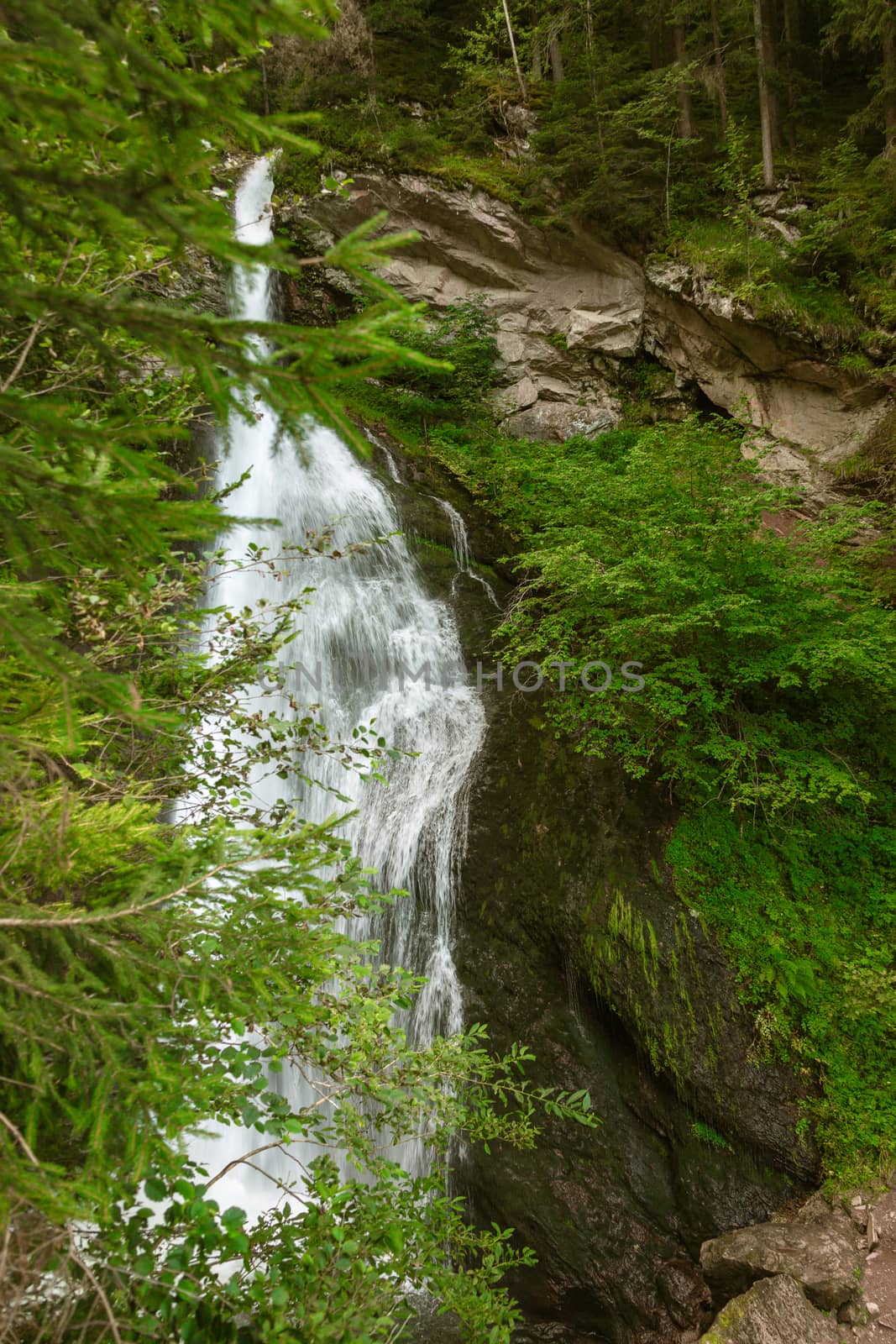 waterfall flowing over rocks in the Alps