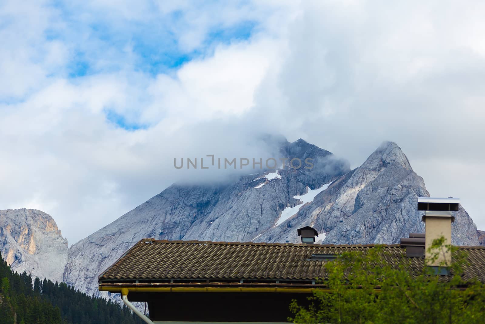 house roof on a background of mountains in the Alps