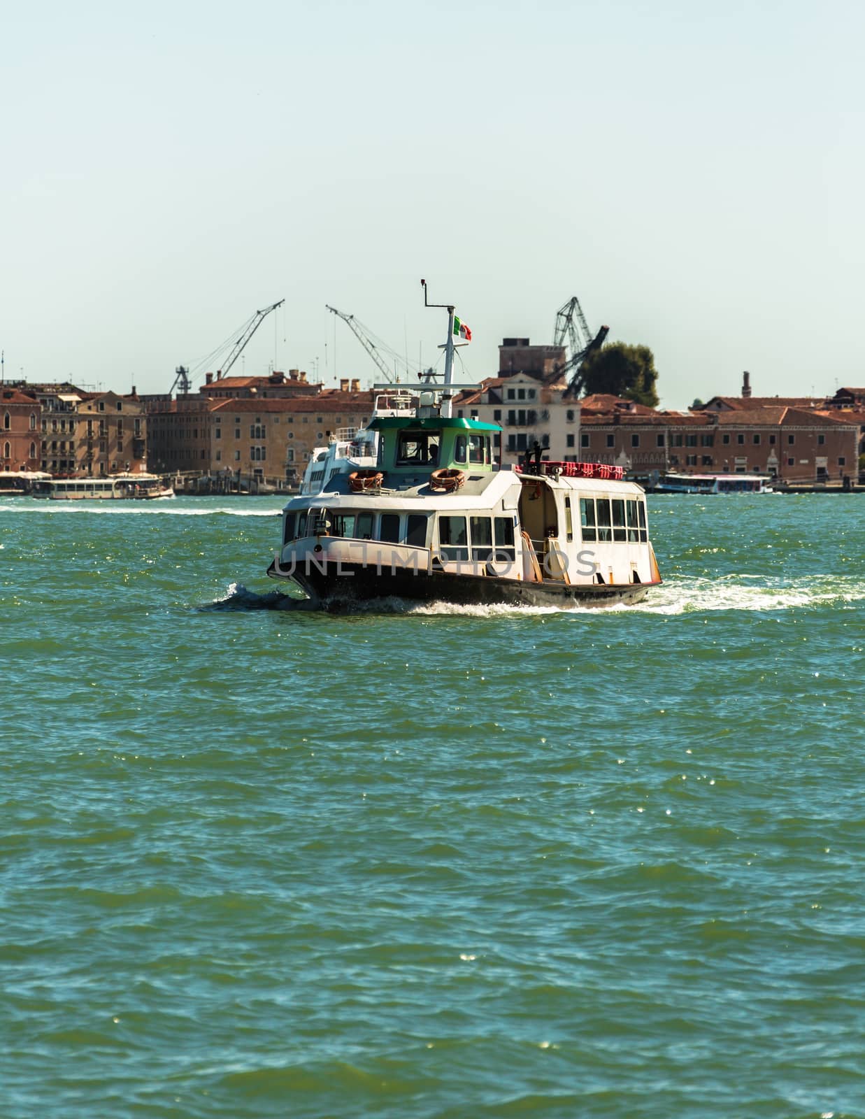 VENICE, ITALY - AUGUST 7 2016: Boat floating from the island of San Giorgio, Venice, Italy