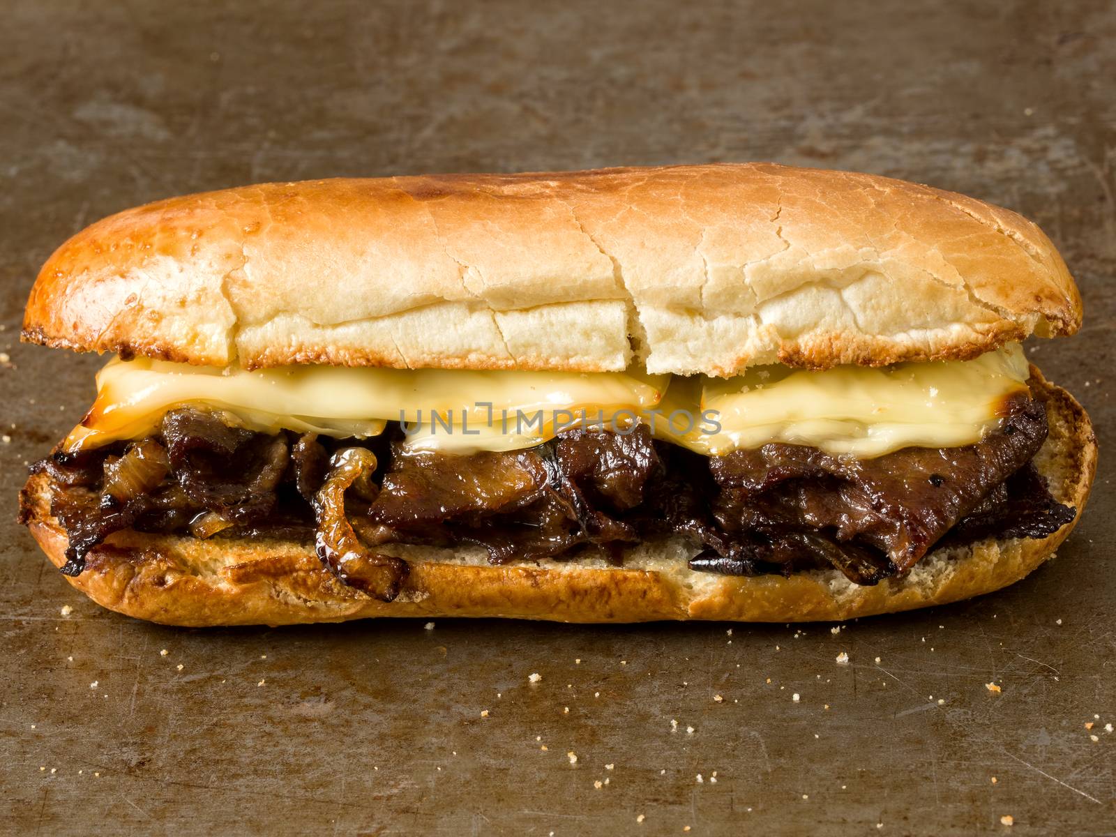close up of rustic philly cheese steak sandwich