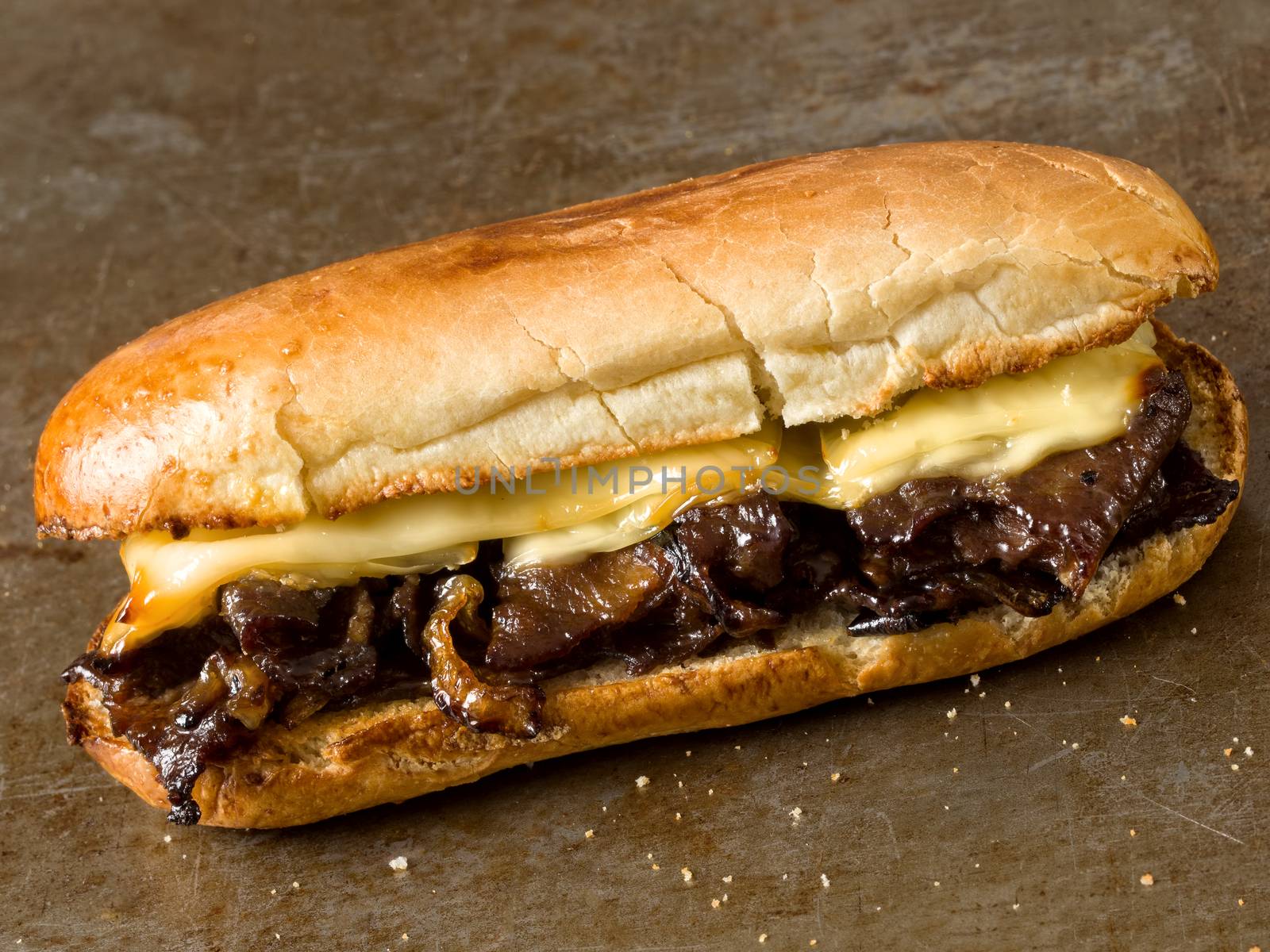 close up of rustic philly cheese steak sandwich