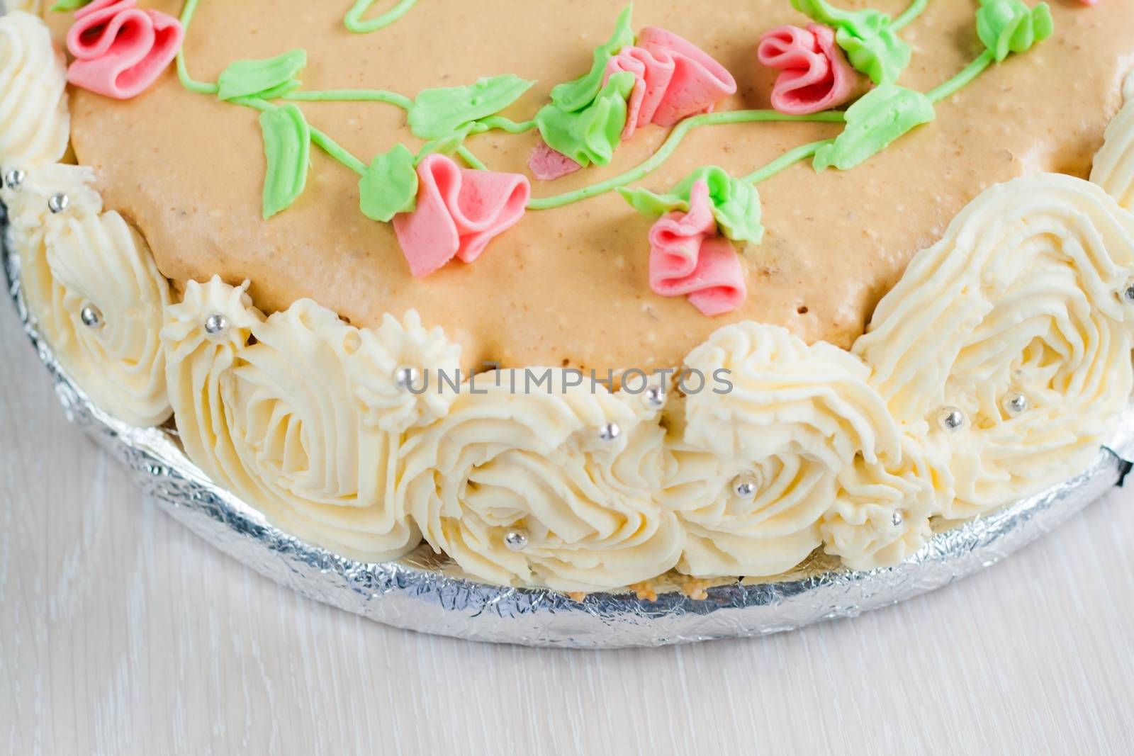 birthday cake decorated with roses, leaves, swirls and the inscription, Catherine Day