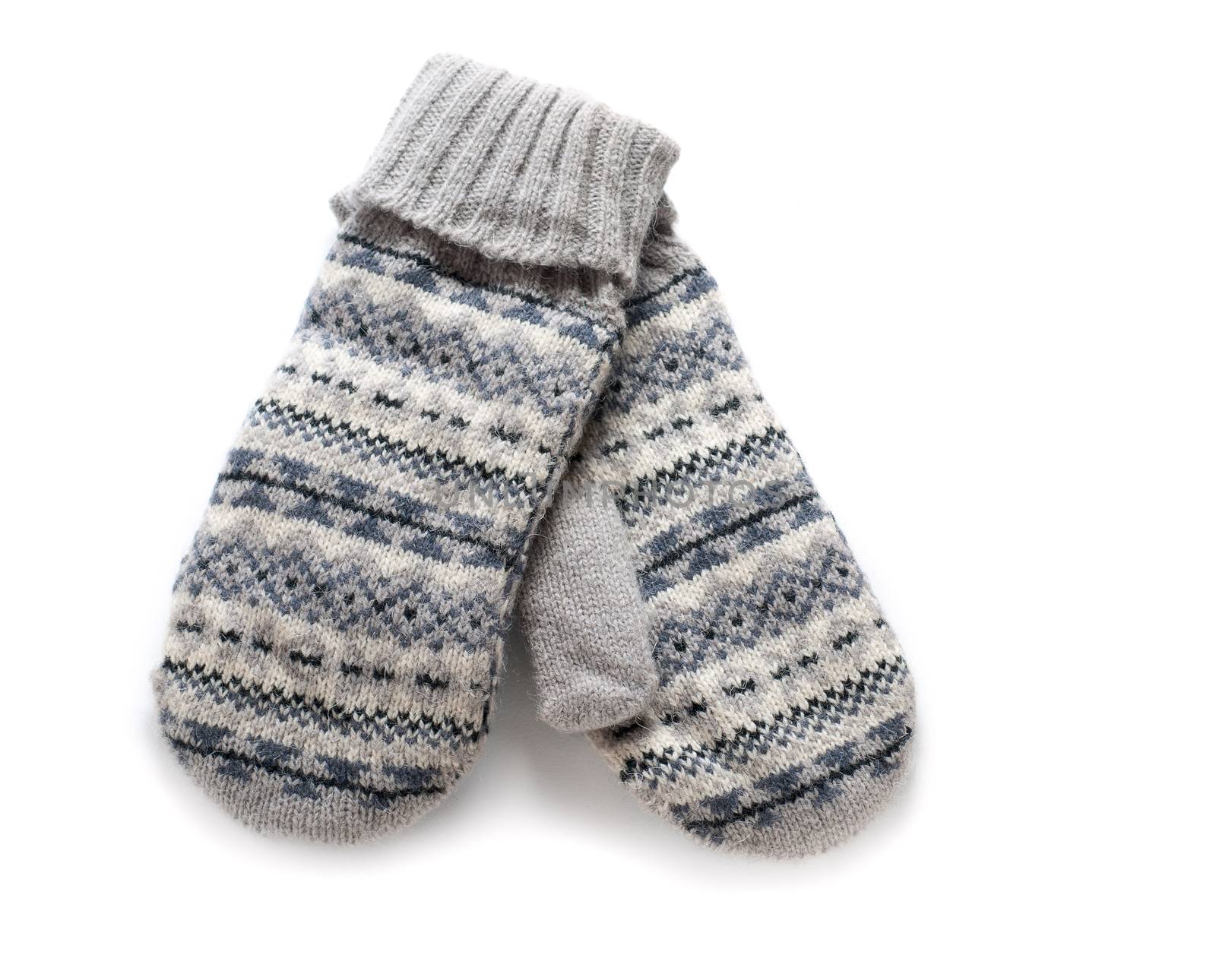 Pair of gray knitted mittens isolated over white