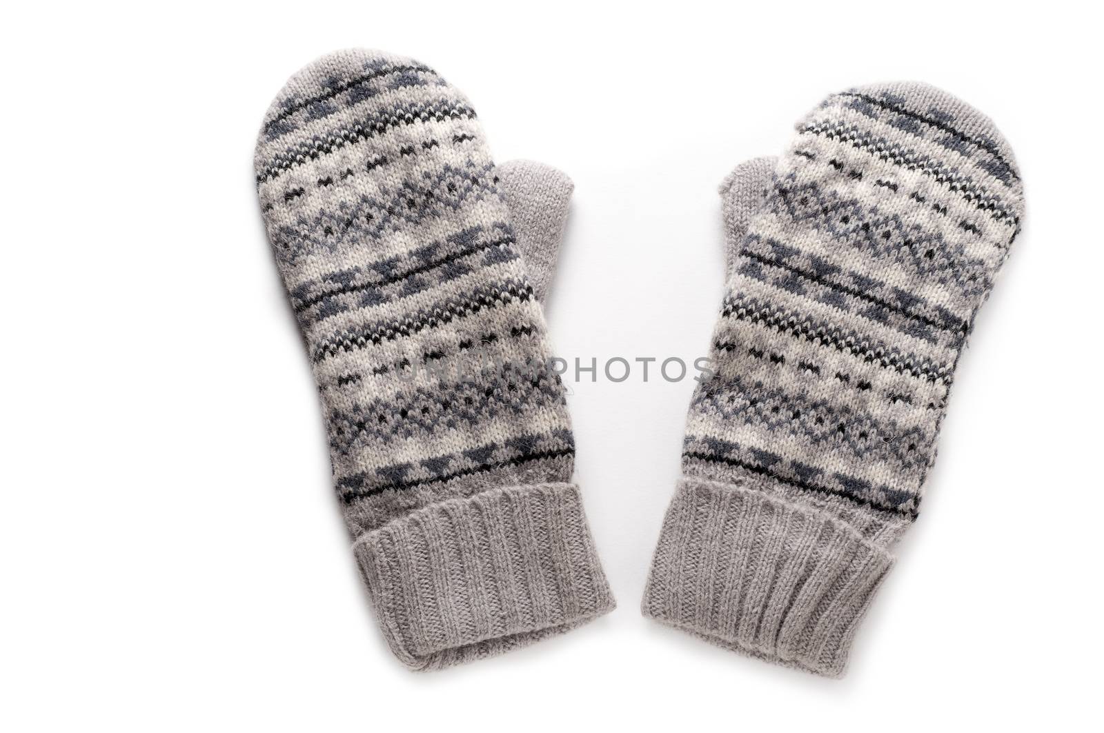 Pair of gray knitted mittens isolated over white