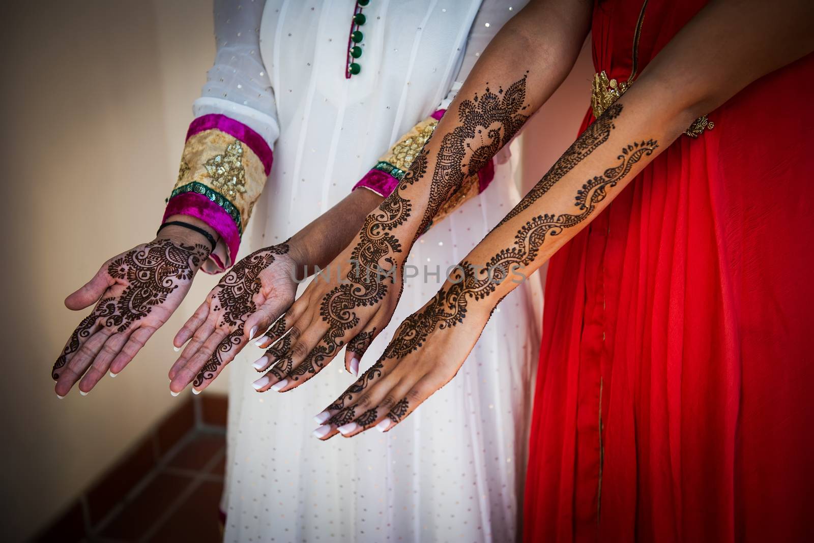 Image of Henna Tattoo's on an Indian bride's hands and friends