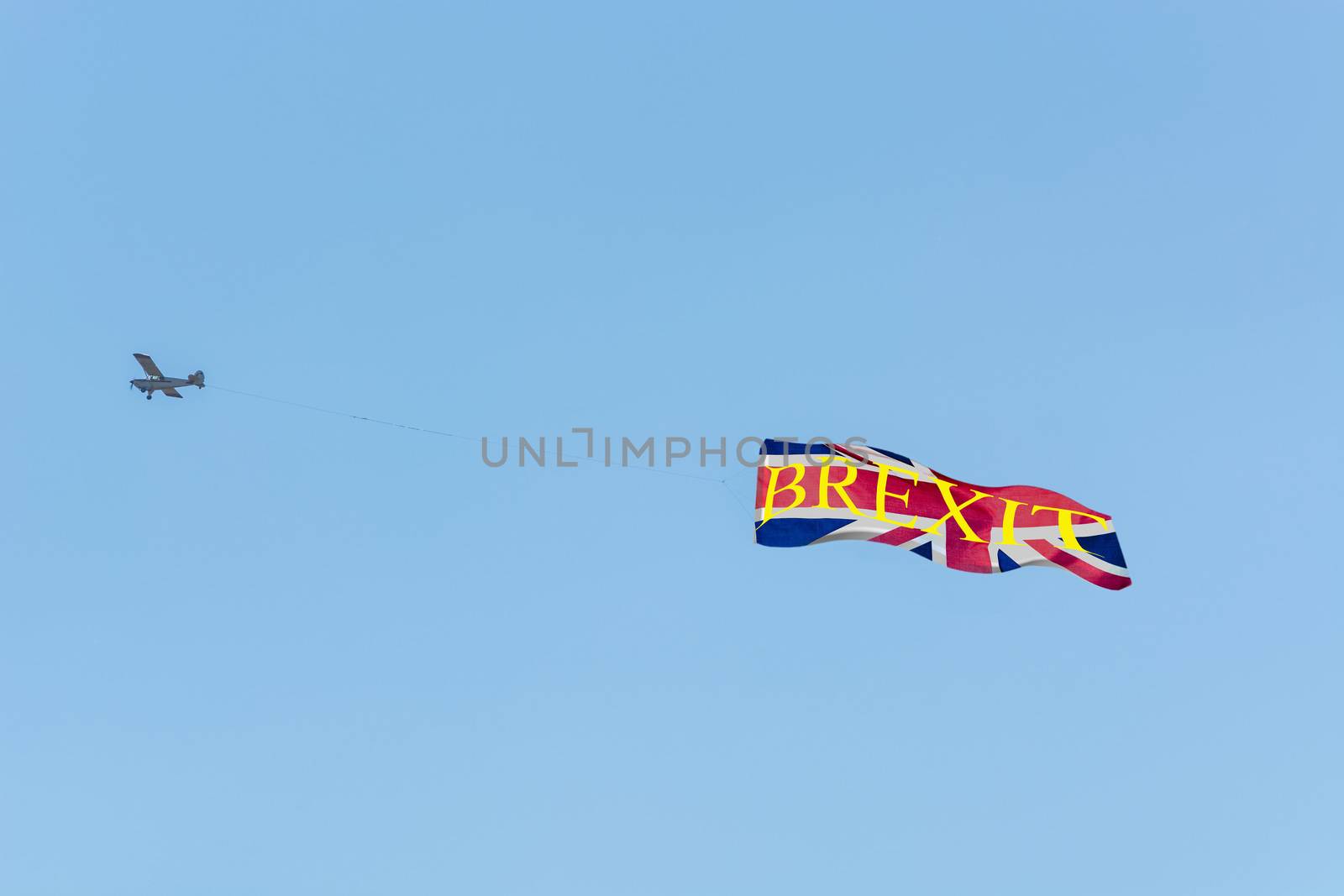 

Banner towing, small engine aircraft towing banners for advertising.
Here the flag of Great Britain with text Proposed referendum on United Kingdom membership of the European Union.