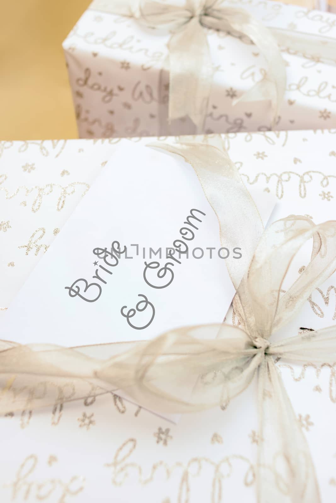 Gift box with ribbon bow for wedding, selective focus.