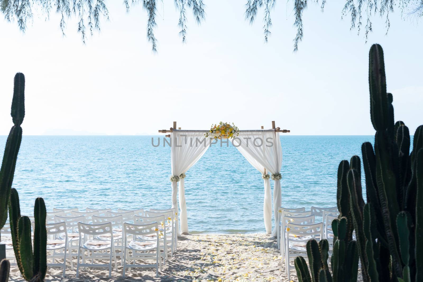 simple style wedding arch and decoration, venue, setup on tropical beach, outdoor beach wedding.